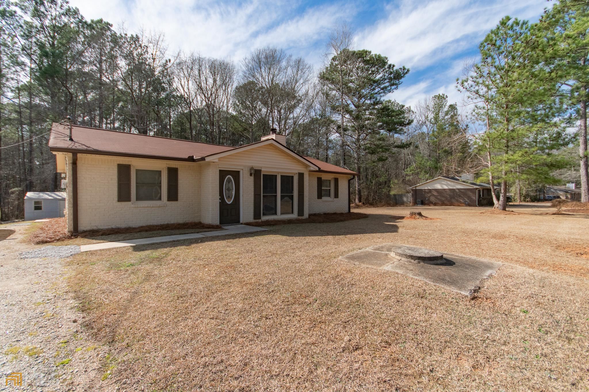 1038 Country Club Road Newnan, GA 30263 - Photo 1 of 1 a view of a house with a yard