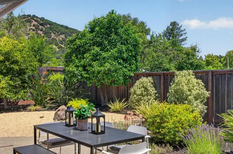 a view of a table and chairs in the patio