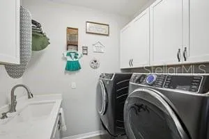 a utility room with dryer and washer