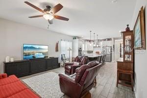 5204 69th Street East Palmetto, FL 34221 - Photo 2 of 11 a living room with furniture and a flat screen tv