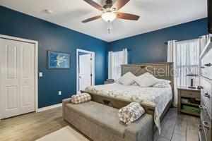 5204 69th Street East Palmetto, FL 34221 - Photo 5 of 11 a spacious bedroom with a bed and a chandelier