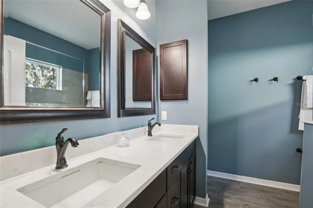 a bathroom with a sink and a mirror