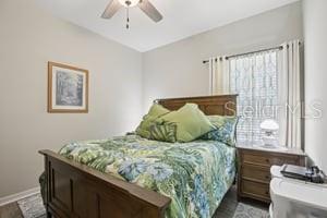 5204 69th Street East Palmetto, FL 34221 - Photo 7 of 11 a bed sitting in a bedroom next to a window