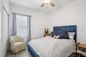 5204 69th Street East Palmetto, FL 34221 - Photo 8 of 11 a bedroom with a bed and a couch