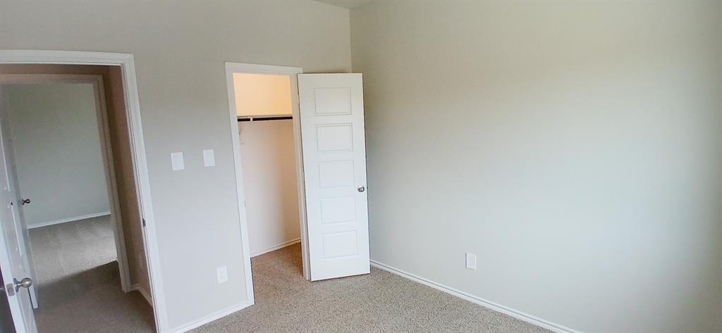 309 Potato Street Keene, TX 76059 - Photo 9 of 16 an empty room with windows