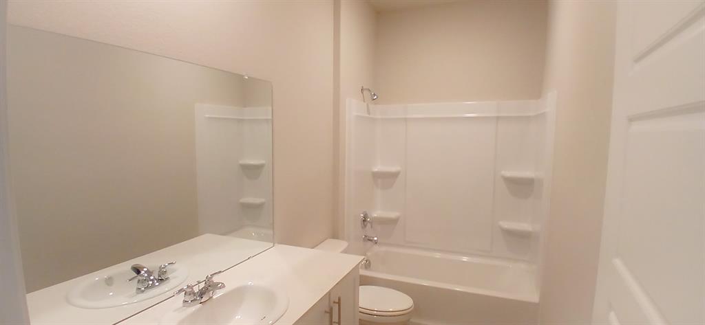 309 Potato Street Keene, TX 76059 - Photo 10 of 16 a bathroom with a bathtub and a shower