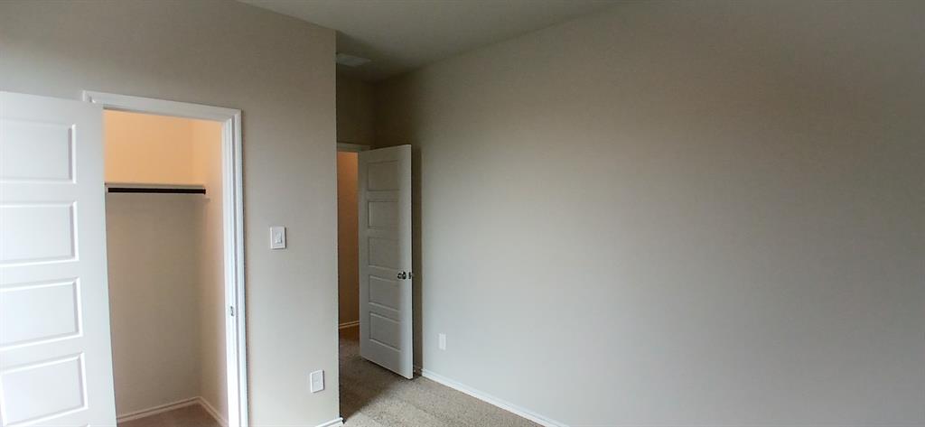 309 Potato Street Keene, TX 76059 - Photo 11 of 16 a view of a hallway with closet