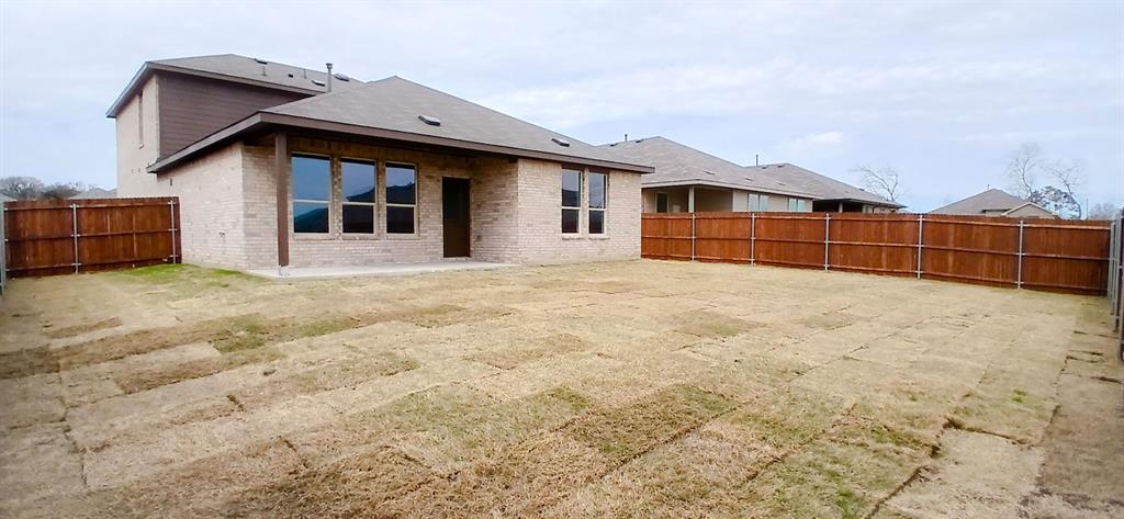309 Potato Street Keene, TX 76059 - Photo 15 of 16 a house with yard in front of it