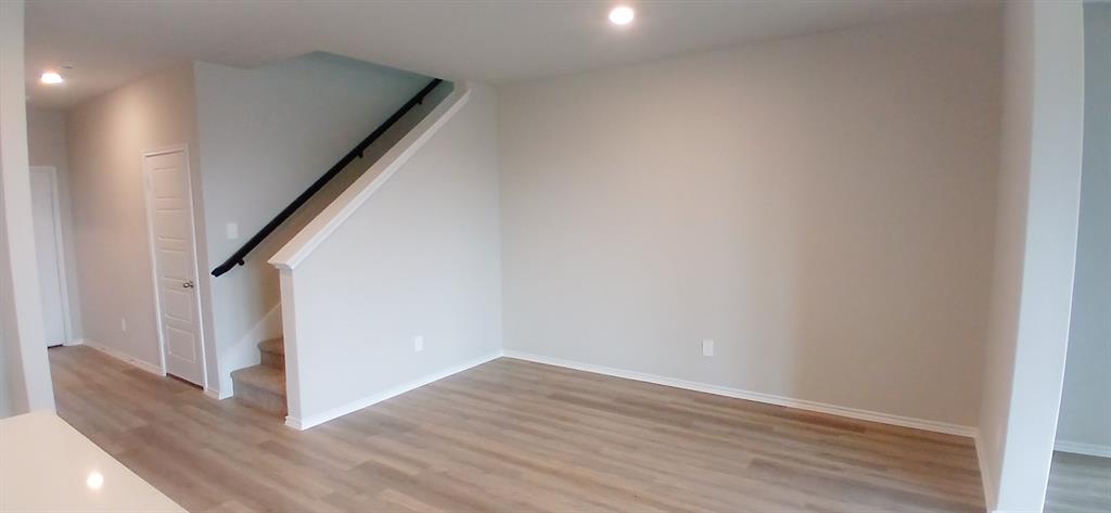 309 Potato Street Keene, TX 76059 - Photo 1 of 16 a view of entryway with wooden floor