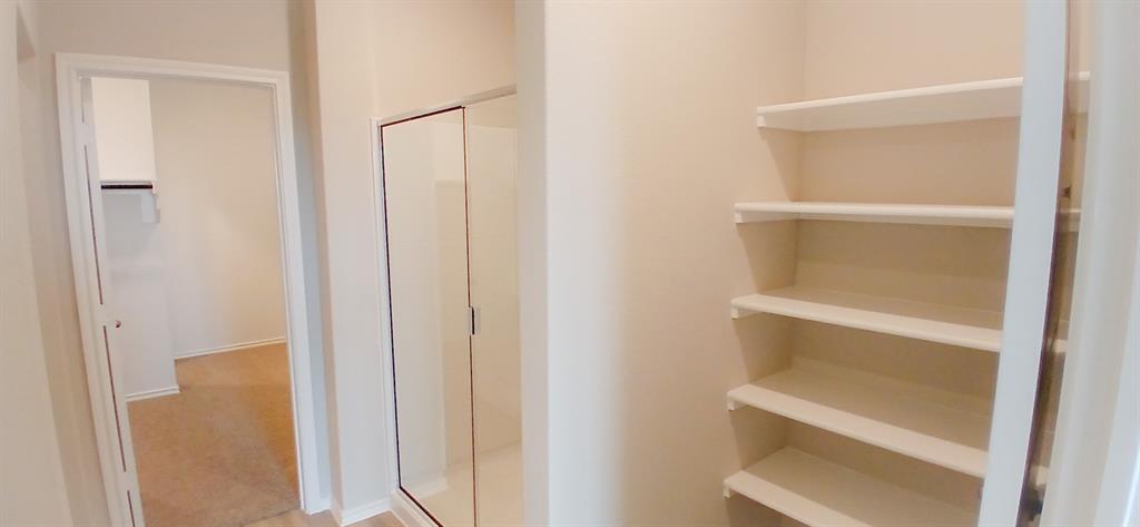 309 Potato Street Keene, TX 76059 - Photo 6 of 16 a view of walk in closet with empty racks