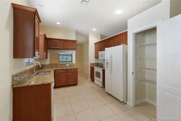 an empty room with closet and a bathroom
