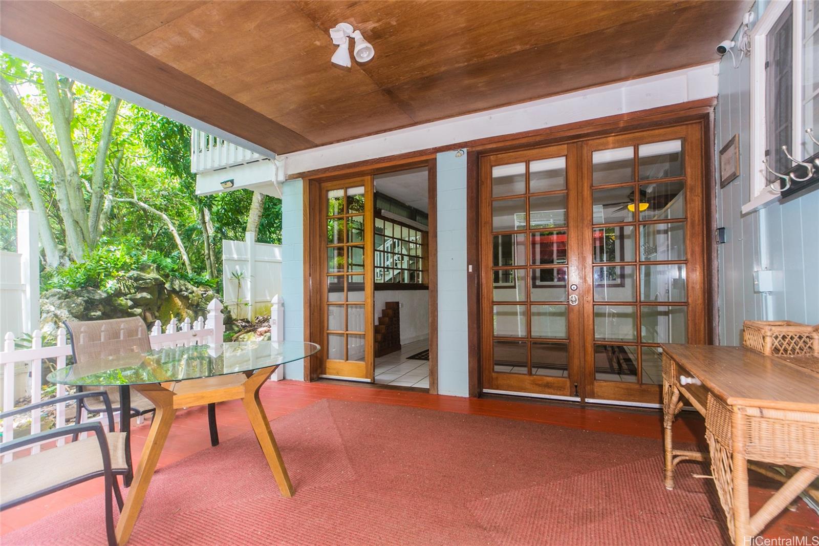 953 Ailuna Street Honolulu, HI 96821 - Photo 11 of 25 a porch with a table and chairs