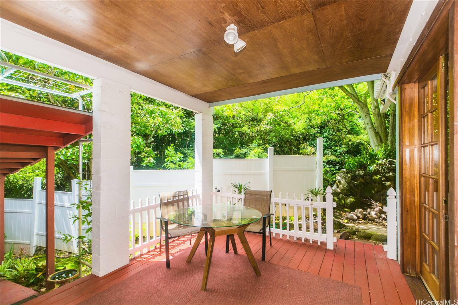 953 Ailuna Street Honolulu, HI 96821 - Photo 12 of 25 a view of a patio with table and chairs potted plants with wooden floor and floor to ceiling window
