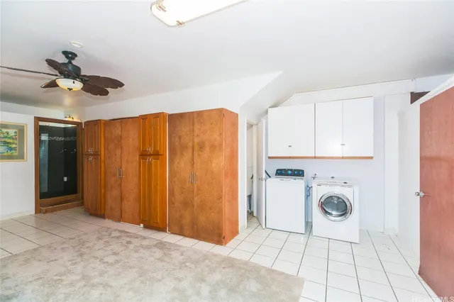 a view of a kitchen with a sink and a refrigerator