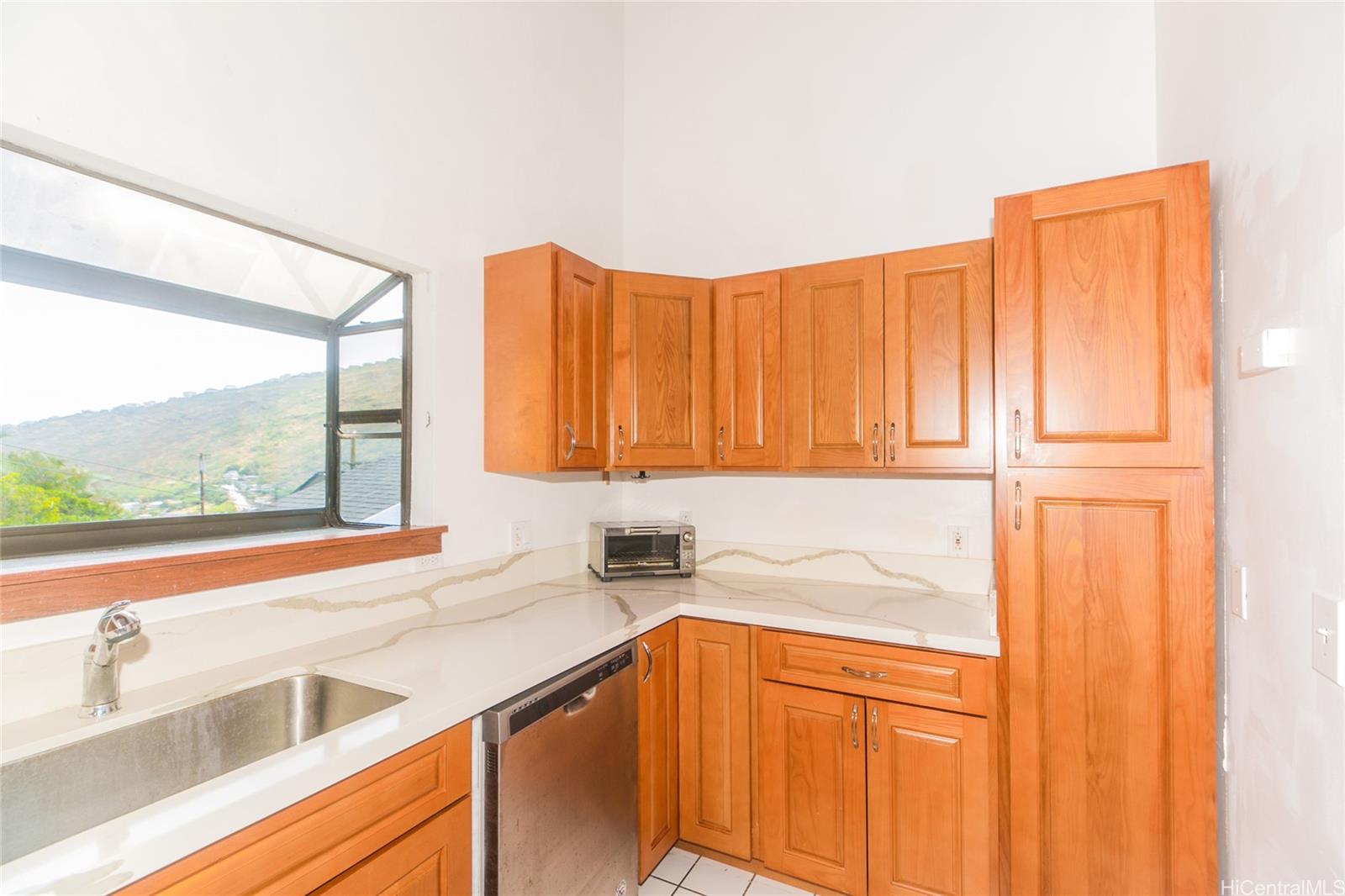 953 Ailuna Street Honolulu, HI 96821 - Photo 17 of 25 a kitchen with a sink and a large window