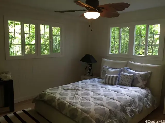 a bedroom with a bed and window