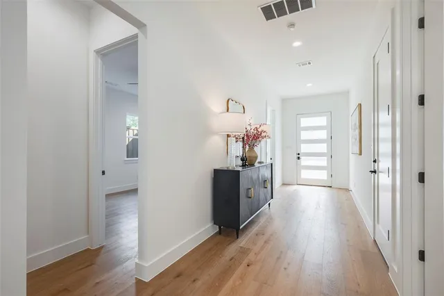 wooden floor with white walls