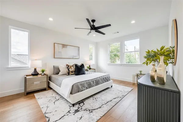 a bedroom with a large bed and a window