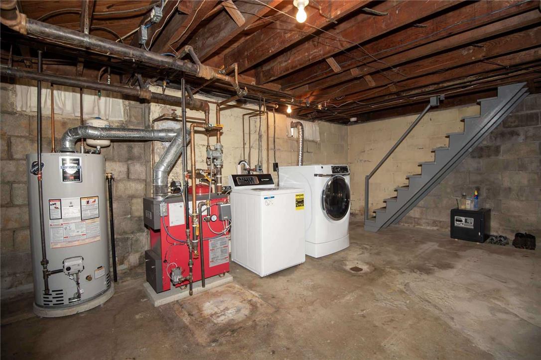 706 Stones Crossing Road Easton, PA 18045 - Photo 24 of 40 A well-equipped utility space features a new robust water heater, gas furnace, and a functional laundry setup.
