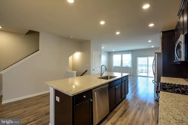 a kitchen with a stove and a sink