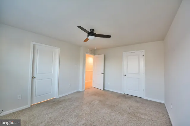 a view of a livingroom with a ceiling fan