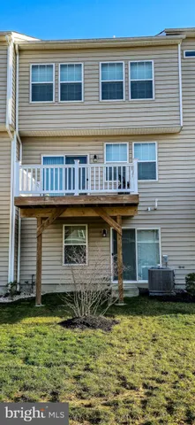 a front view of a house with a large pool