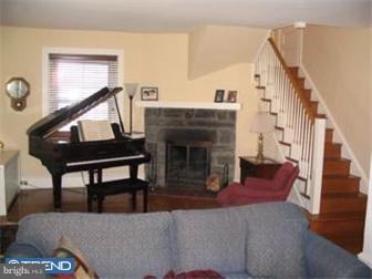 6 Church Road Ardmore, PA 19003 - Photo 2 of 12 a living room with furniture and a fireplace