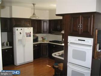 6 Church Road Ardmore, PA 19003 - Photo 5 of 12 a kitchen with refrigerator and cabinets