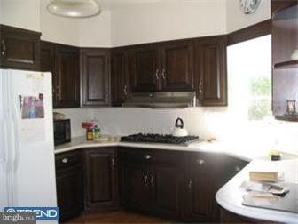 6 Church Road Ardmore, PA 19003 - Photo 6 of 12 a kitchen with a sink a stove and cabinets