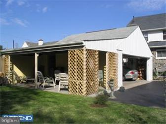 6 Church Road Ardmore, PA 19003 - Photo 10 of 12 a view of a patio with table and chairs with wooden floor and fence