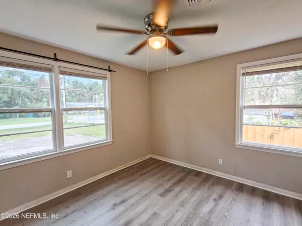a view of a bathroom from a hallway