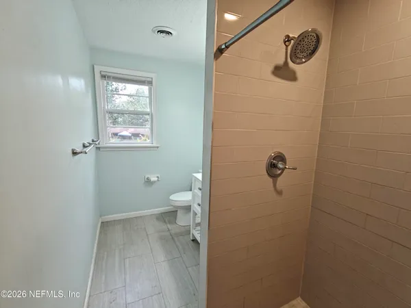 a view of a bathroom from the hallway