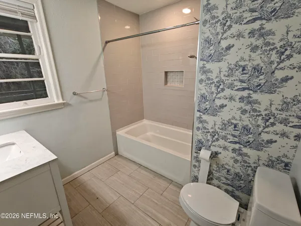 a view of balcony with wooden floor