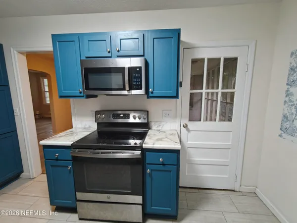 a white refrigerator freezer sitting in a kitchen