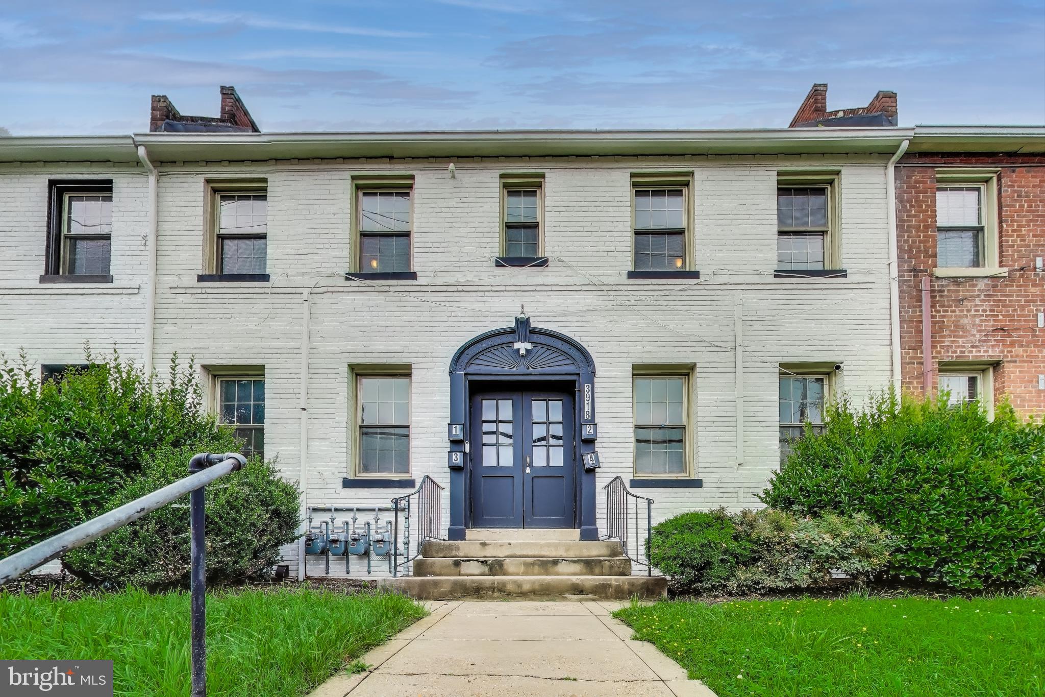 3918 10th Street Northeast, Unit 3 Washington, DC 20017 - Photo 1 of 69 a front view of a house with a yard