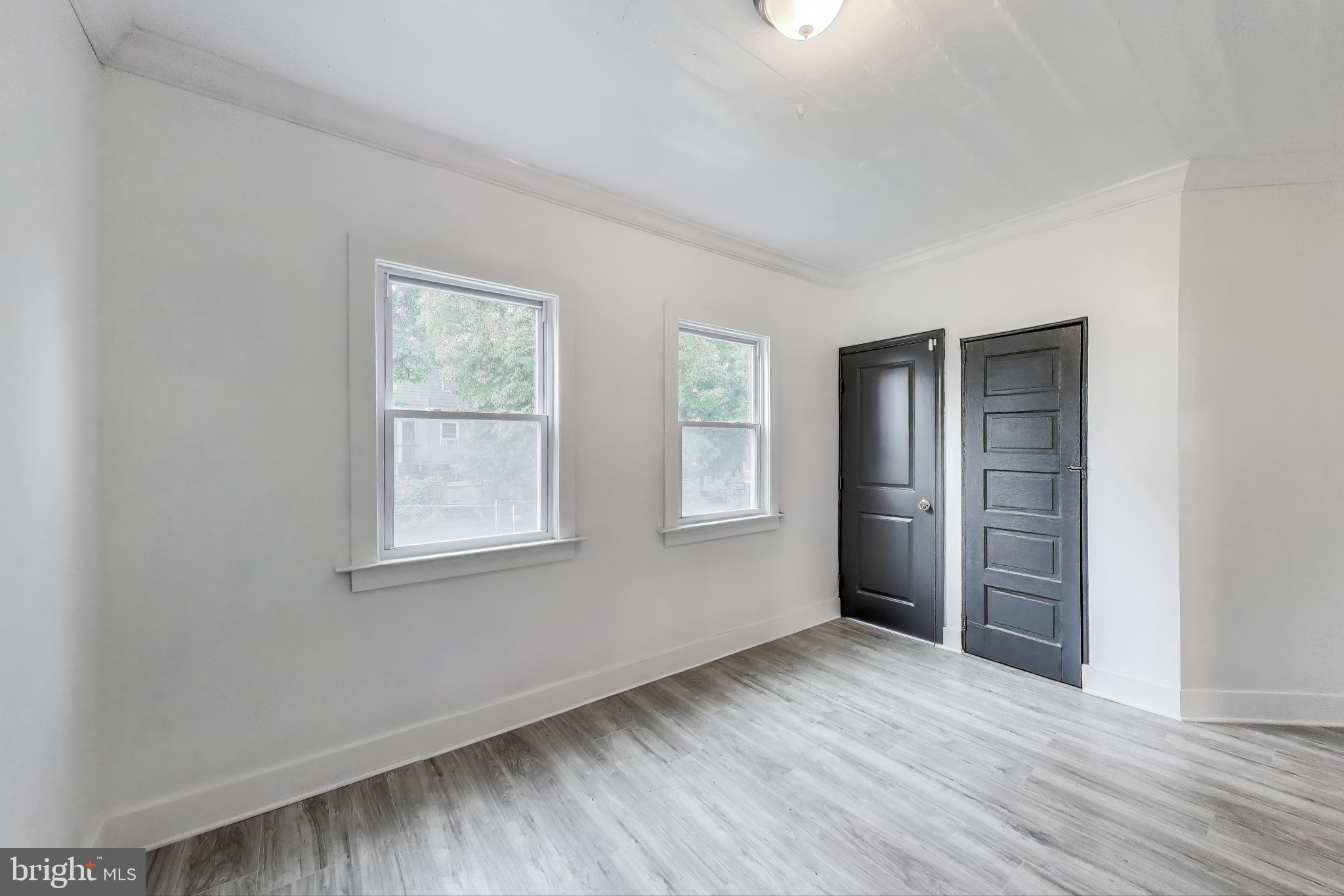 3918 10th Street Northeast, Unit 3 Washington, DC 20017 - Photo 13 of 69 an empty room with windows and closet