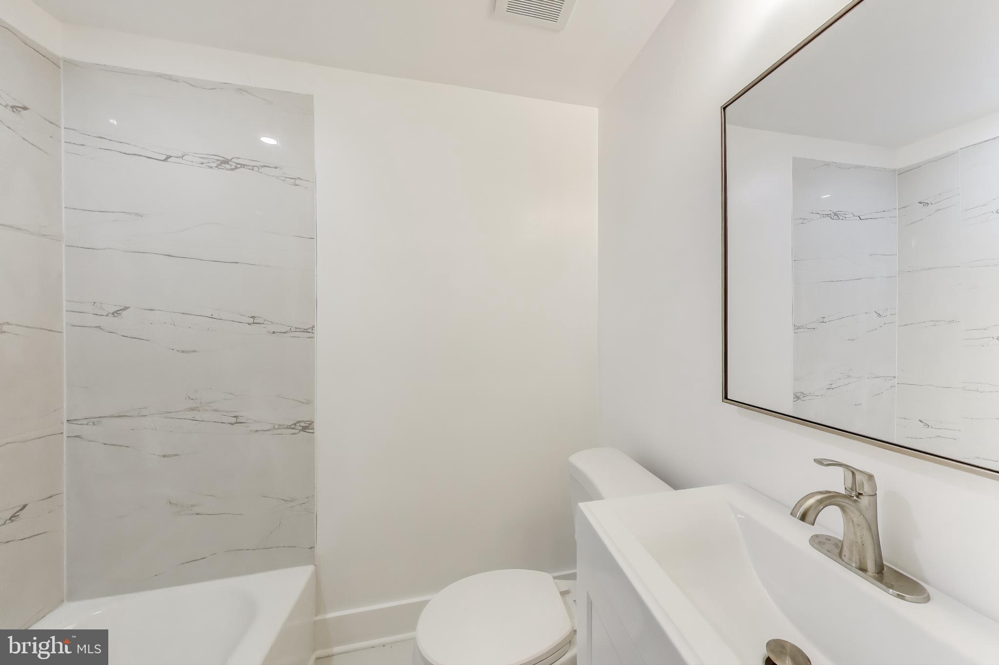 3918 10th Street Northeast, Unit 3 Washington, DC 20017 - Photo 15 of 69 a bathroom with a sink and a tub