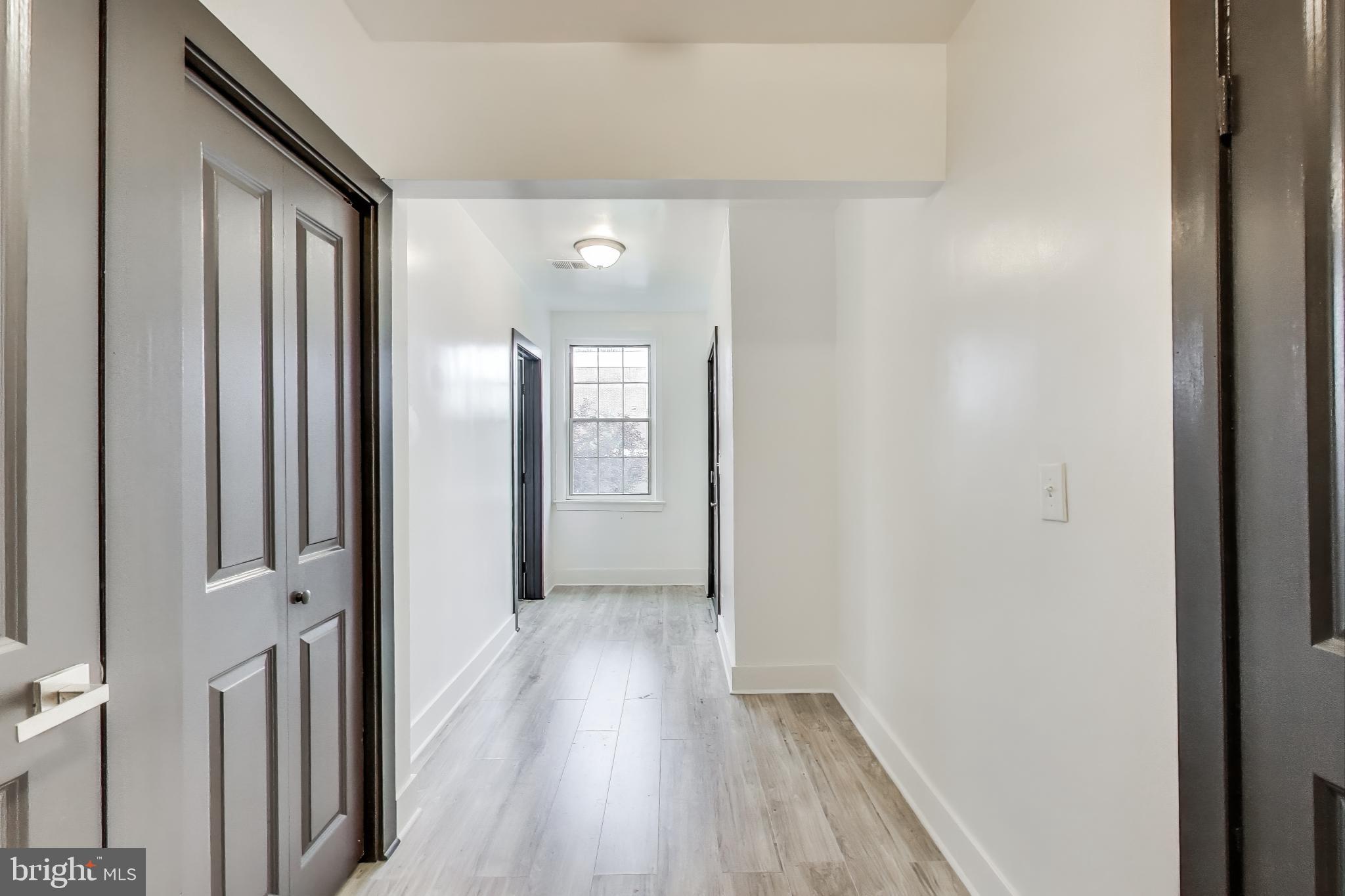 3918 10th Street Northeast, Unit 3 Washington, DC 20017 - Photo 19 of 69 a view of a hallway with wooden floor