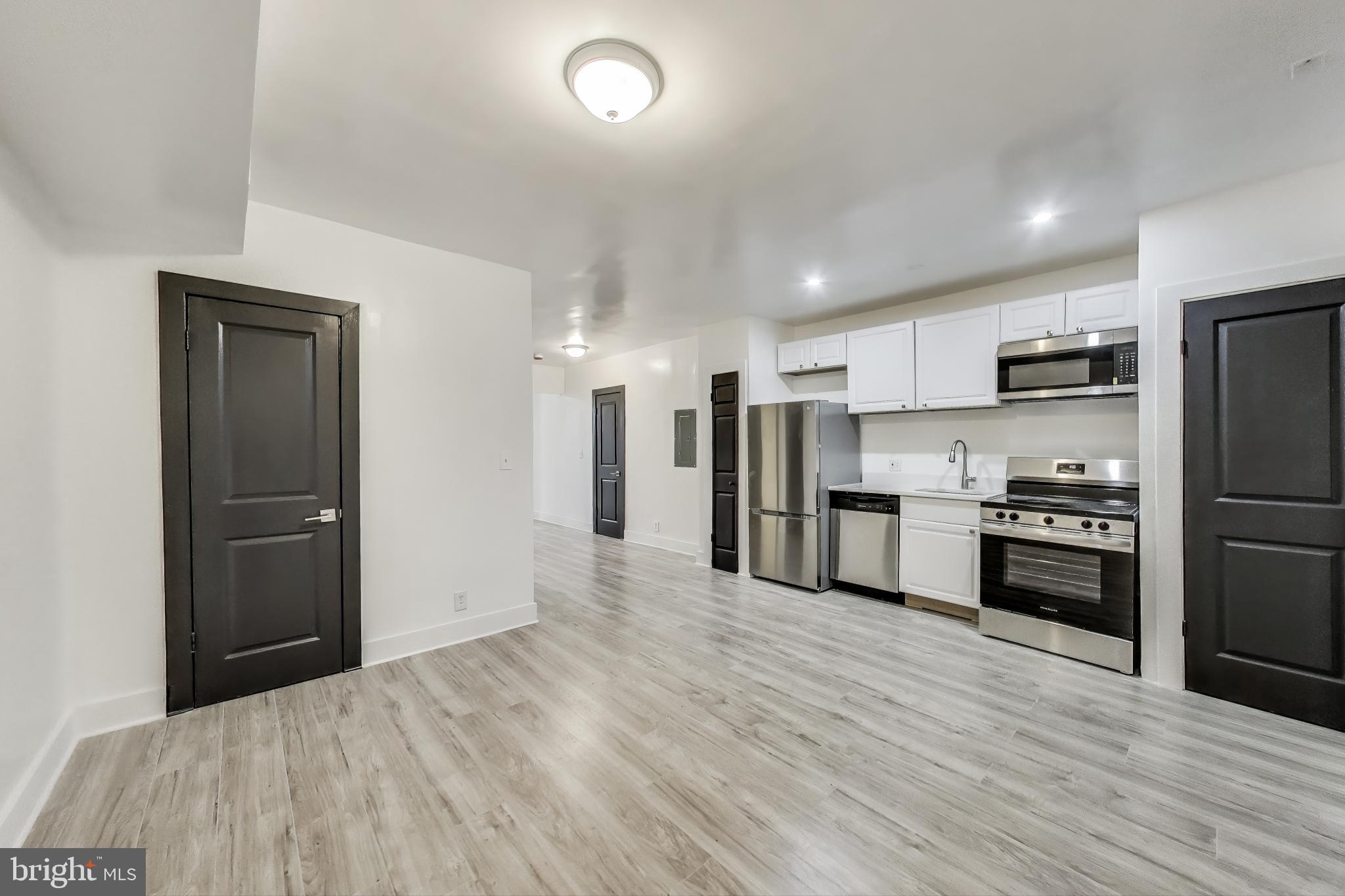 3918 10th Street Northeast, Unit 3 Washington, DC 20017 - Photo 22 of 69 a kitchen with stainless steel appliances a refrigerator and a stove top oven