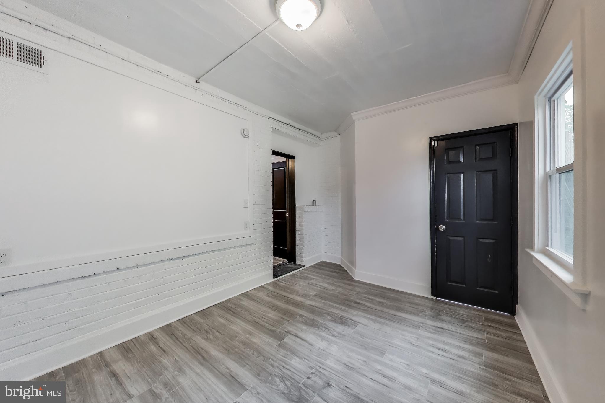 3918 10th Street Northeast, Unit 3 Washington, DC 20017 - Photo 30 of 69 a view of an empty room and window