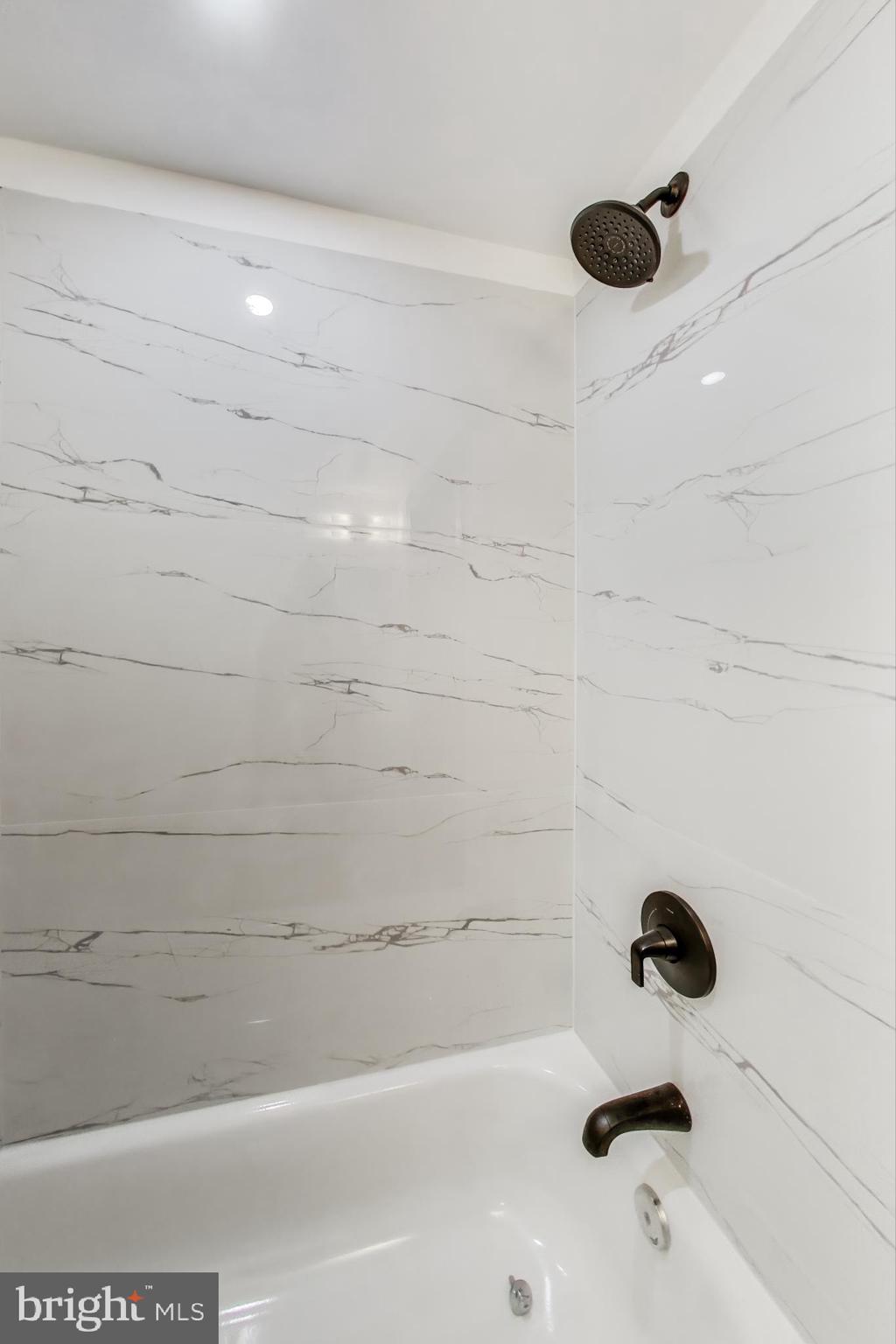 3918 10th Street Northeast, Unit 3 Washington, DC 20017 - Photo 32 of 69 a bathroom with a bathtub