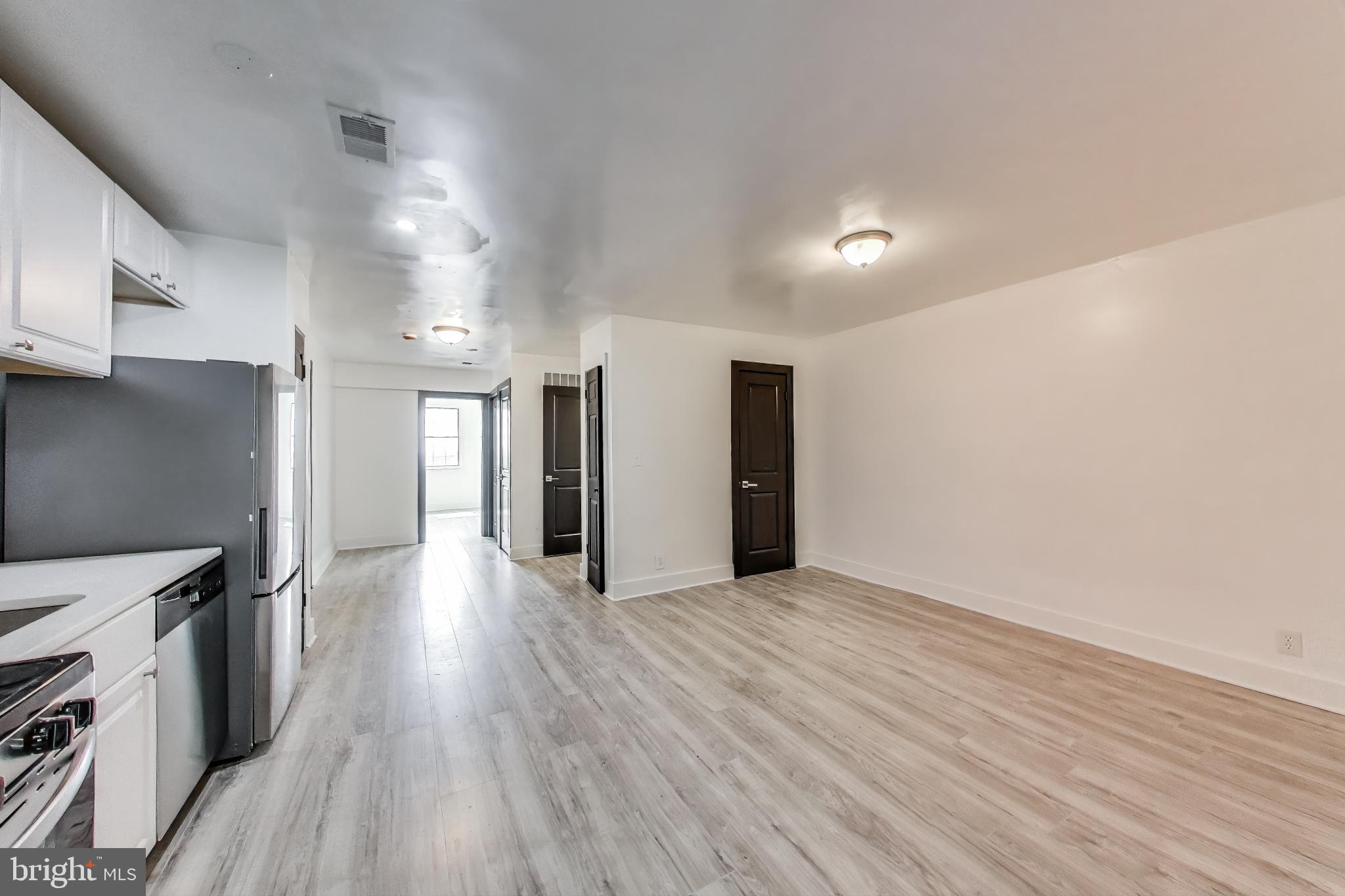 3918 10th Street Northeast, Unit 3 Washington, DC 20017 - Photo 39 of 69 a view of a kitchen with a sink and a stove top oven