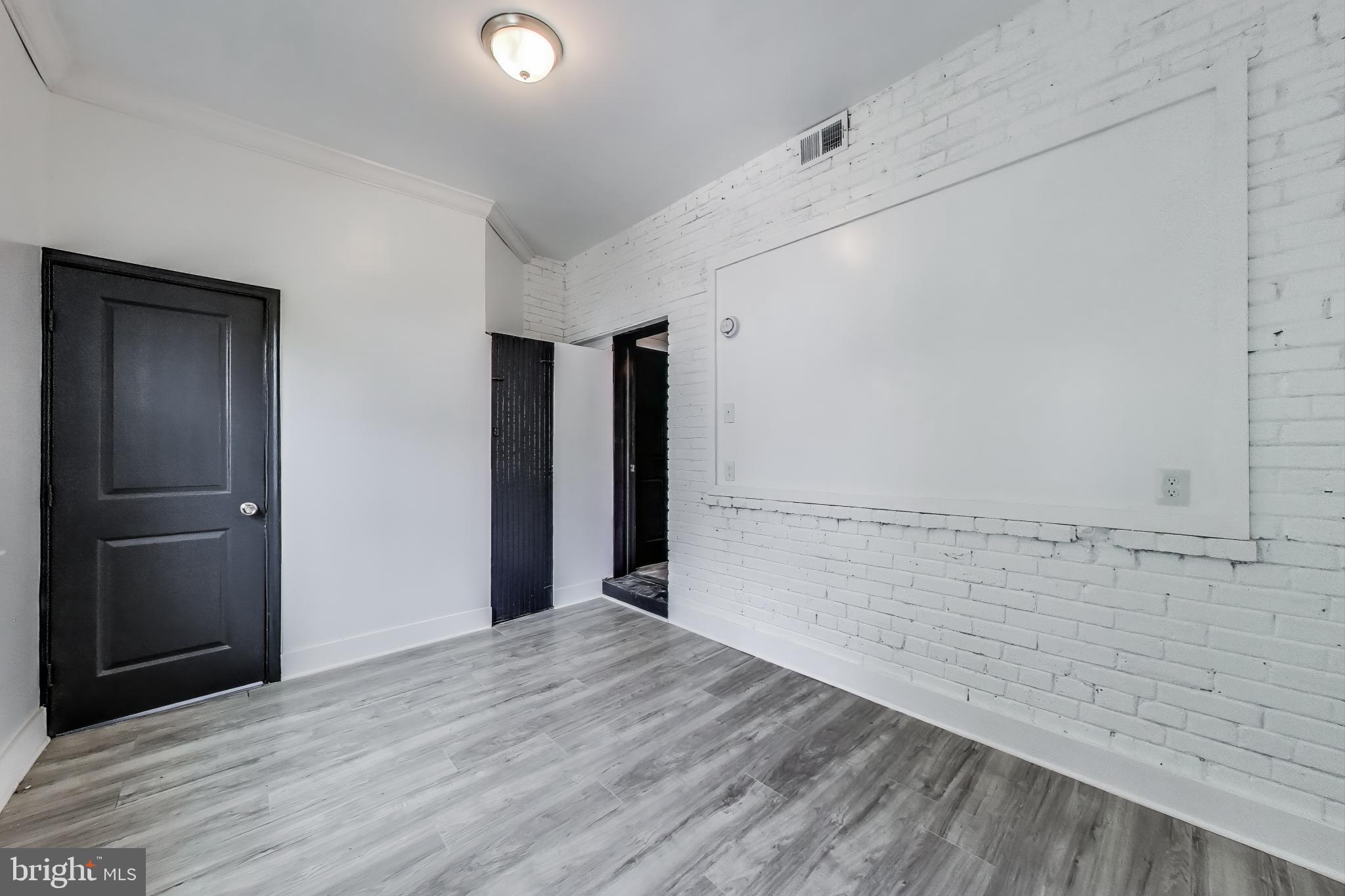 3918 10th Street Northeast, Unit 3 Washington, DC 20017 - Photo 46 of 69 a view of an empty room with wooden floor