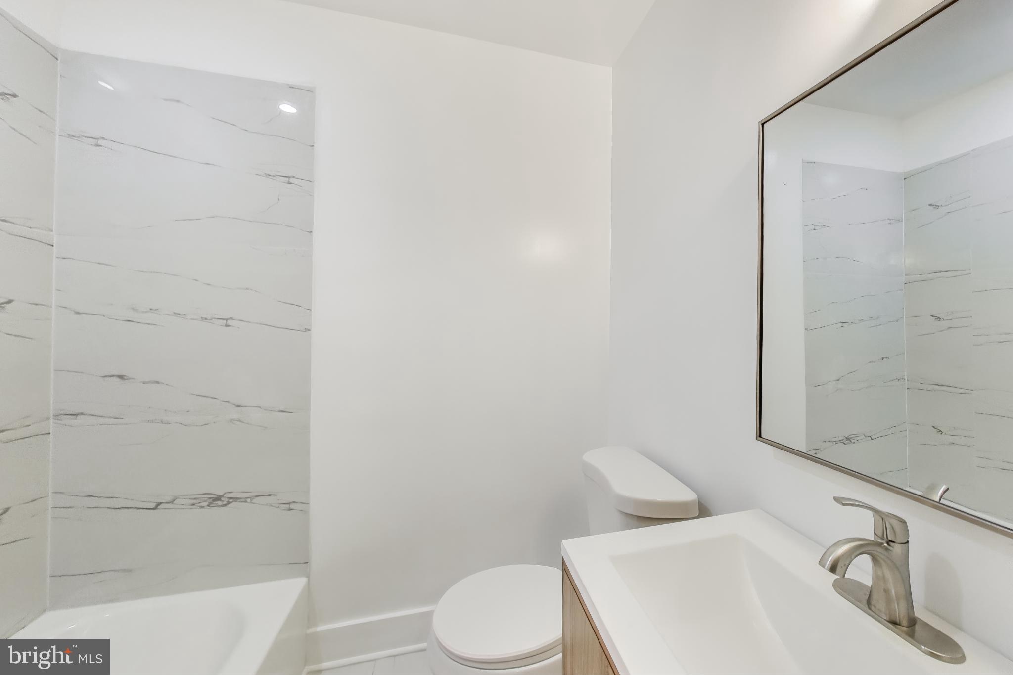 3918 10th Street Northeast, Unit 3 Washington, DC 20017 - Photo 47 of 69 a bathroom with a sink toilet and shower