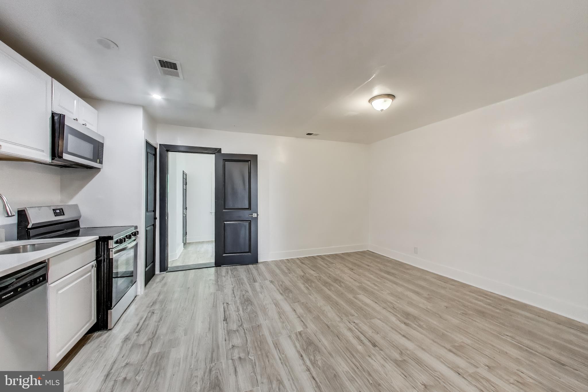 3918 10th Street Northeast, Unit 3 Washington, DC 20017 - Photo 52 of 69 a view of a kitchen with a sink and a stove top oven