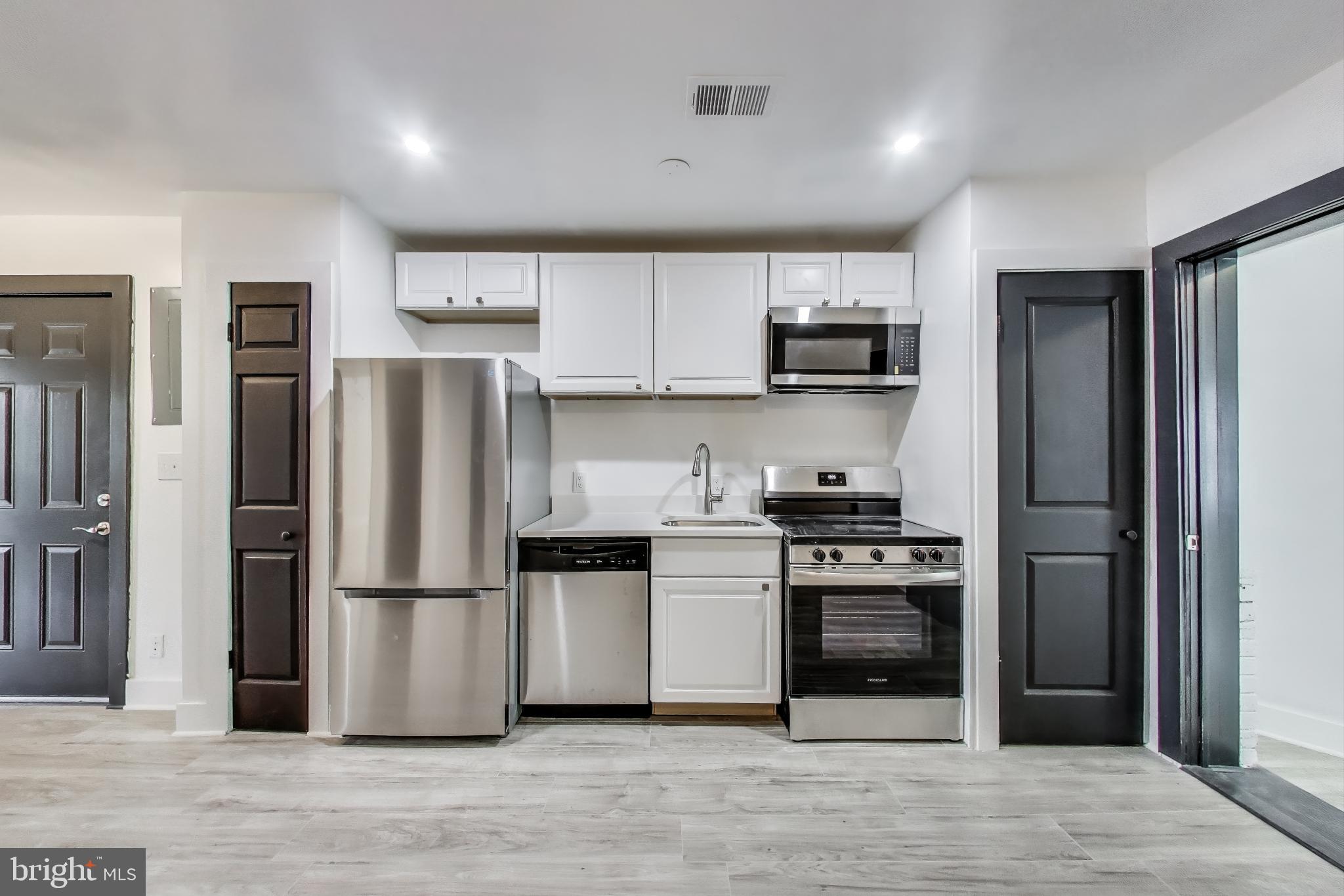 3918 10th Street Northeast, Unit 3 Washington, DC 20017 - Photo 55 of 69 a kitchen with stainless steel appliances and a refrigerator