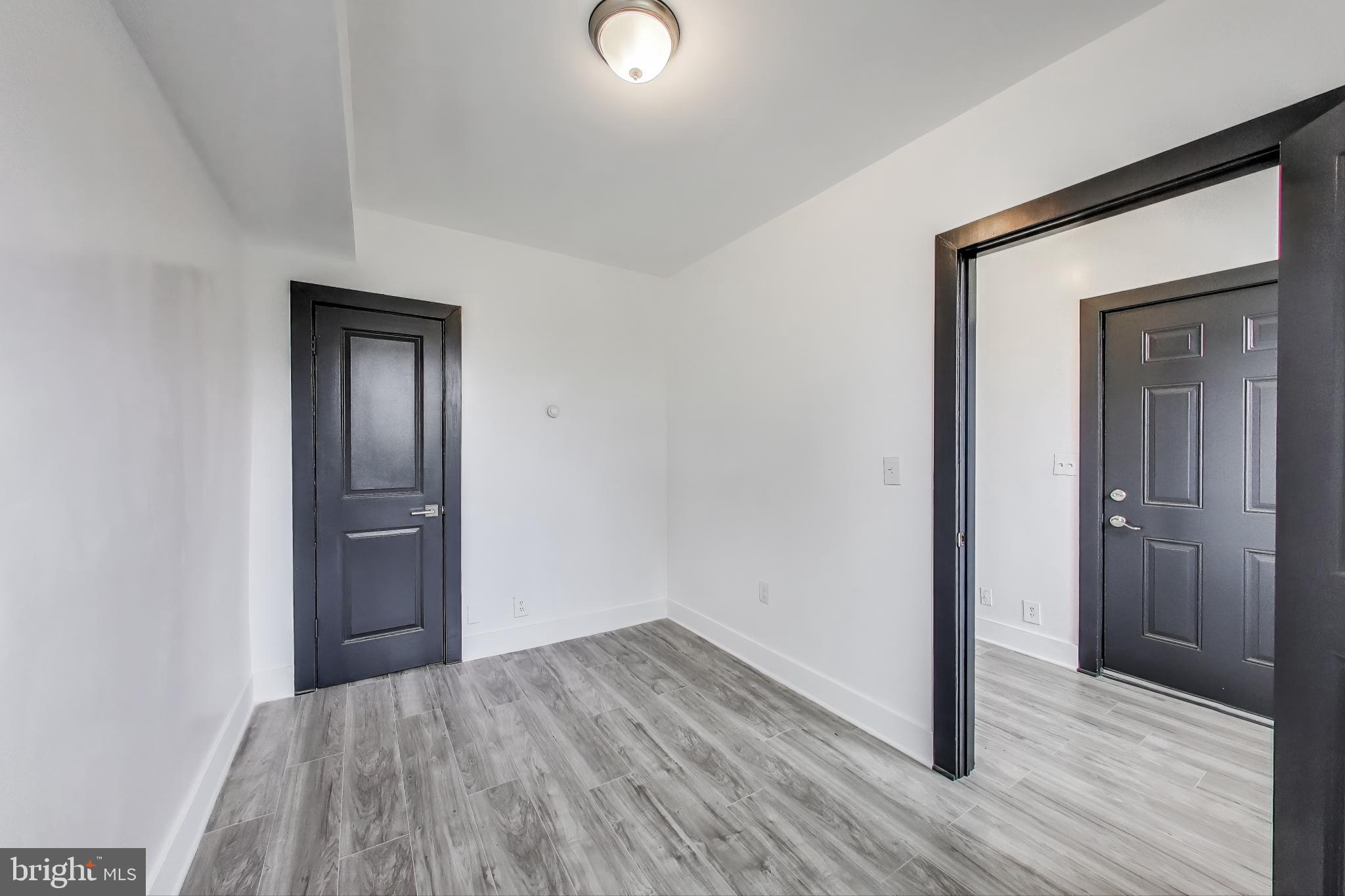 3918 10th Street Northeast, Unit 3 Washington, DC 20017 - Photo 10 of 69 a view of a hallway with wooden floor