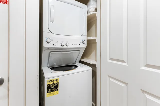 a view of a storage & utility room with a washer dryer