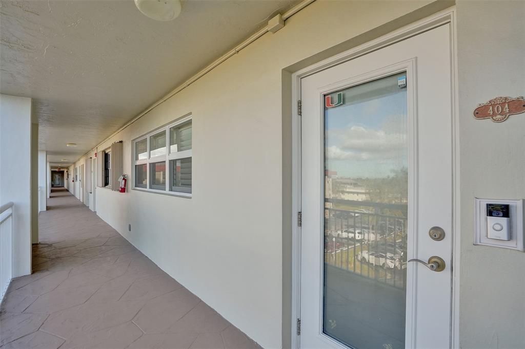 3180 Northeast 48th Court, Unit 404 Lighthouse Point, FL 33064 - Photo 8 of 79 Welcome to #404 Penthouse Level of Coral Key with impact front door.