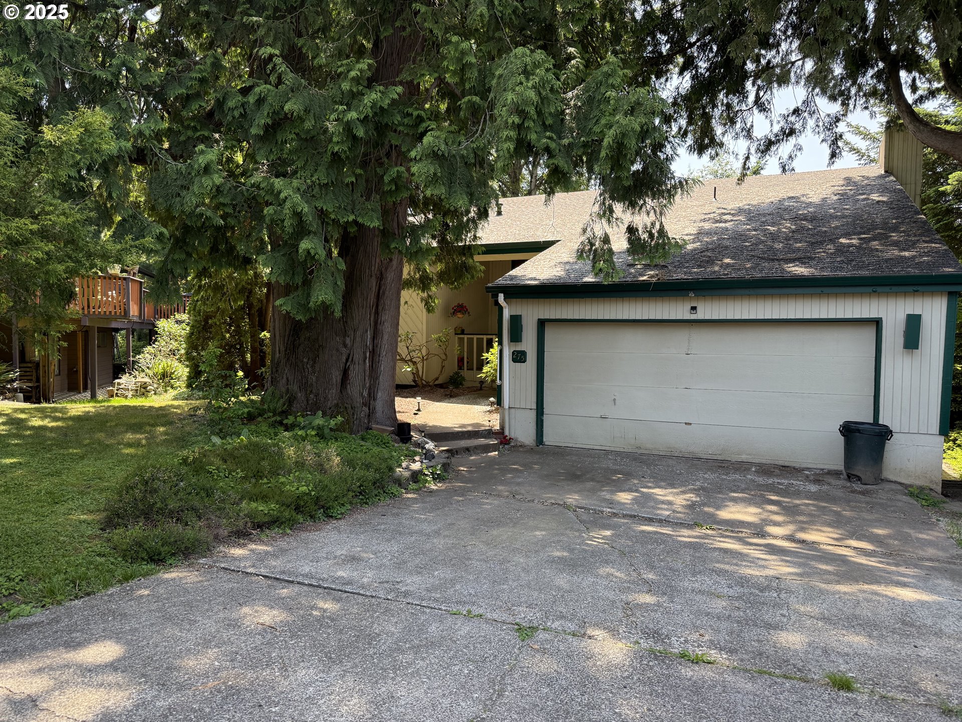 a view of a house with a sitting area and garage